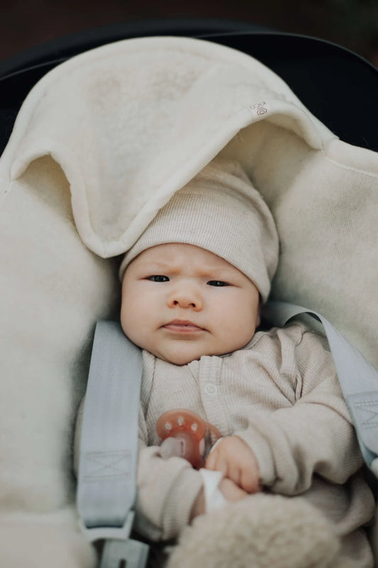 Wollen wikkeldoek met maxi cosi openingen